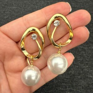 Gold teardrop earrings with pearls
